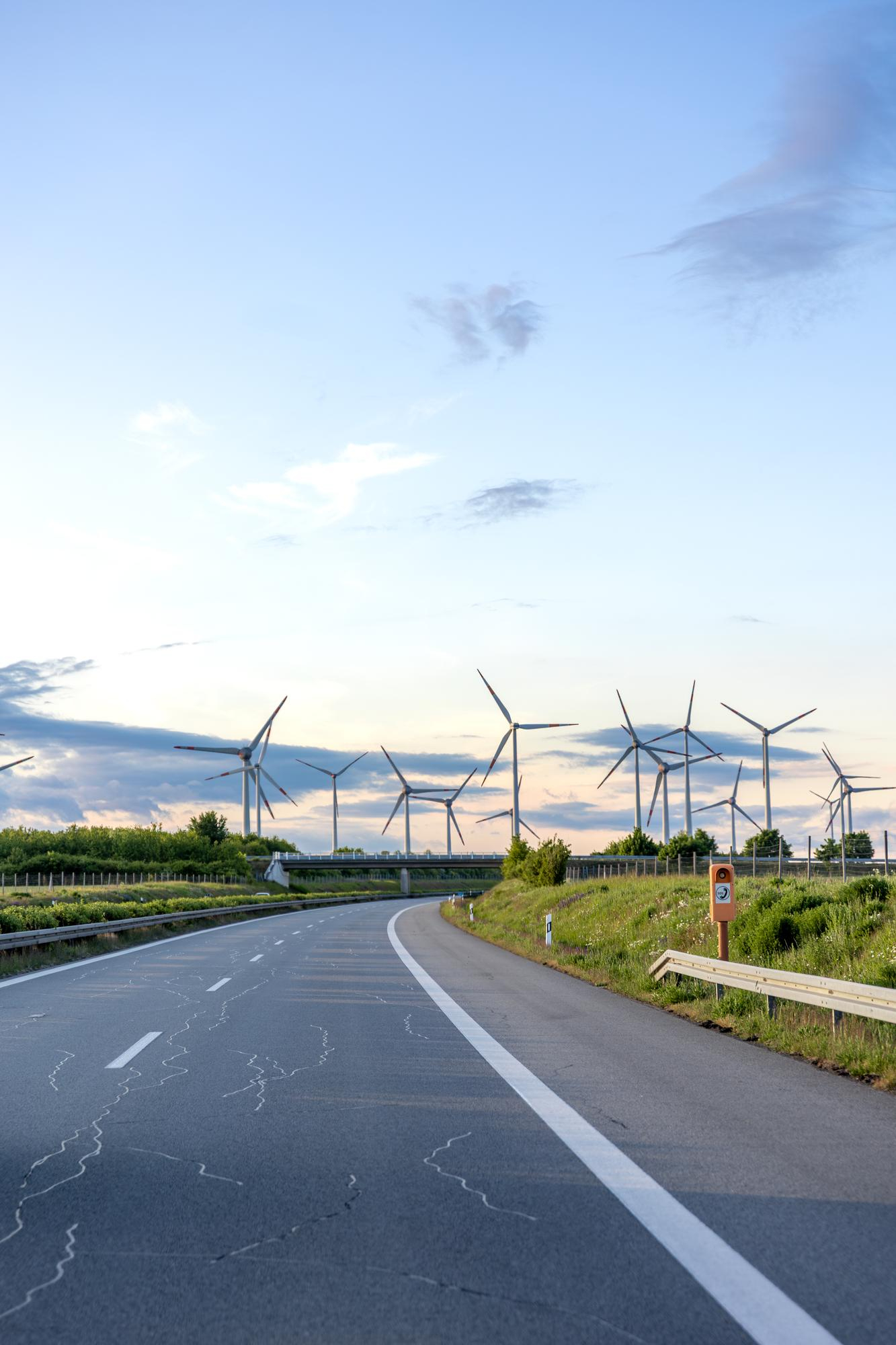 Wind turbines generating renewable energy across an open landscape